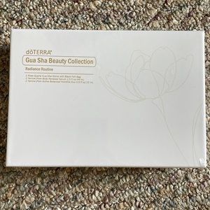 DoTERRA Gua Sha Beauty kit. Includes a rose quartz gua sha stone with oils.